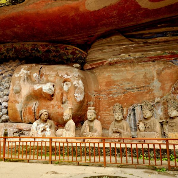 Ancient,giant,stone,cliff,carving,of,buddha,in,parinirvana,